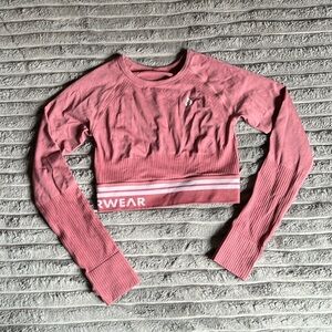 Ryderwear long sleeved fitted crop fitness shirt in pink, size Small.